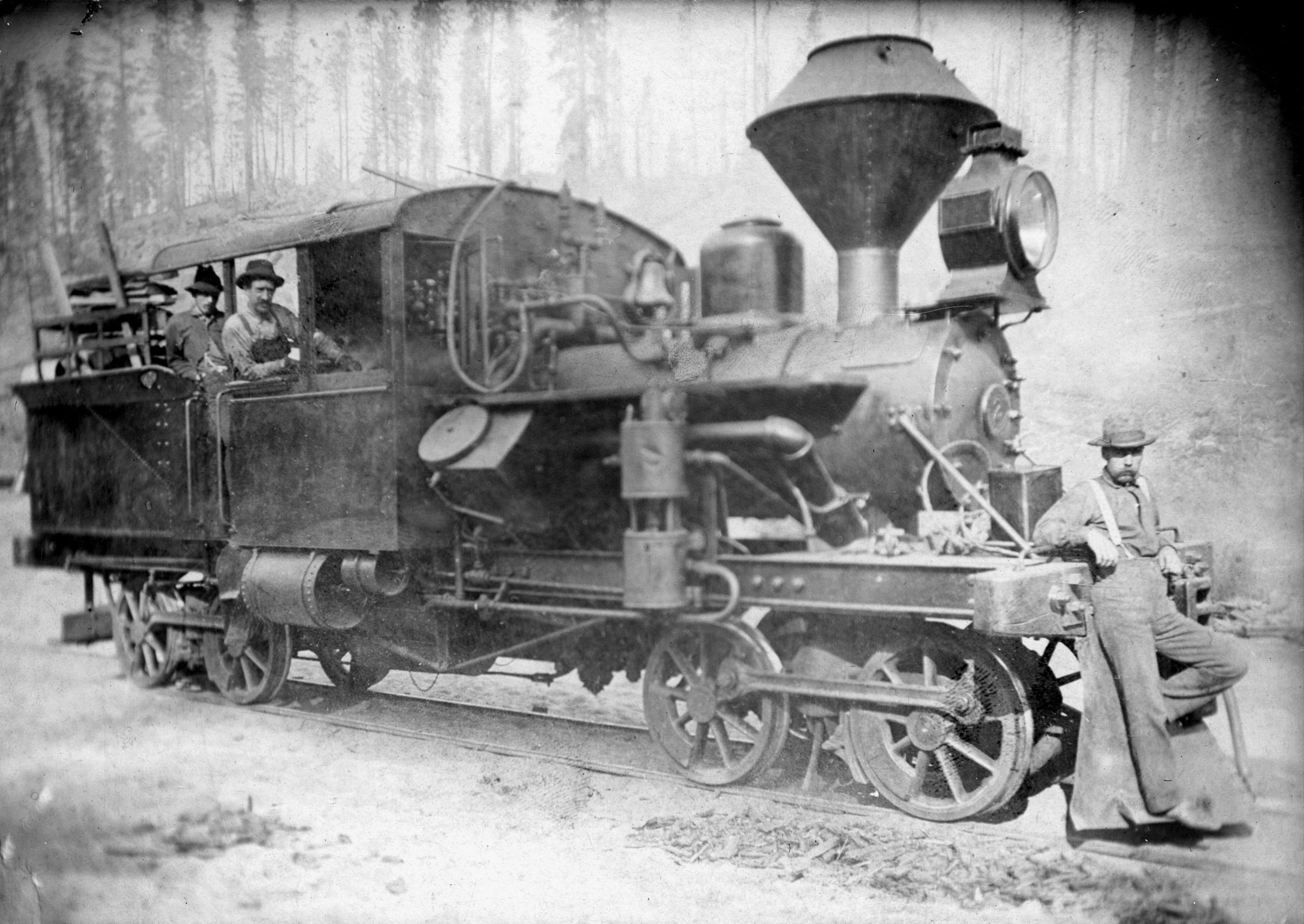 Heisler No. 2, a geared steam locomotive, photographed with three crew members on a logging line in El Dorado County, California, about 1898.